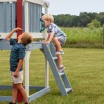 Kids Outdoor Playhouse with Slide – Elevated Blue Playhouse with Ladder & Balcony - Image 3